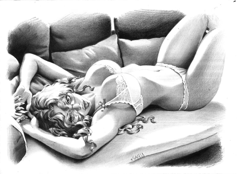 seductive girl lying on a sofa