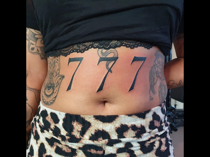 Lettering tattoo 777