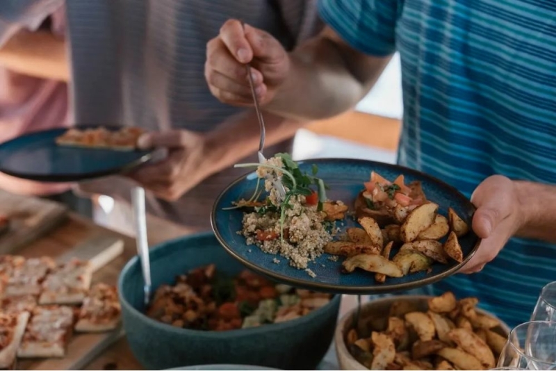 Relaxed outdoor dinner during surf holiday in Algarve Portugal