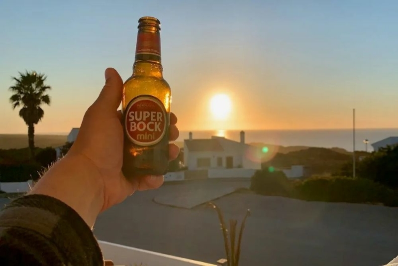 Sunset over the west coast Algarve cliffs near Monte Clérigo