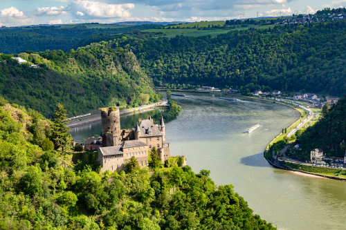 sky-view-castle-on-river-surrounded-with-nature-germany