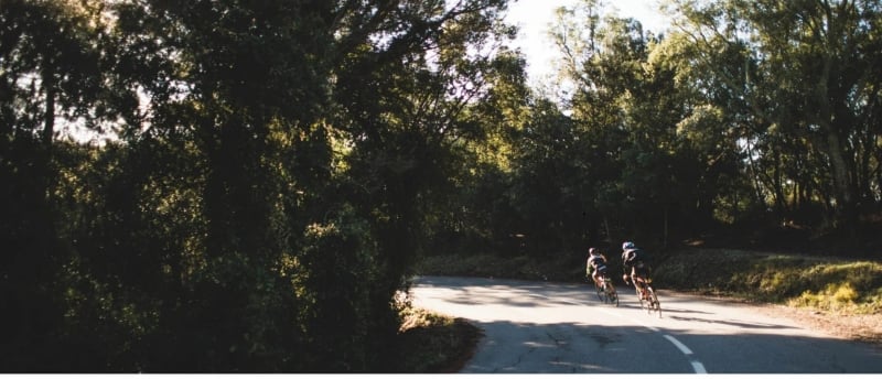 Active Athletes Shop, 2 cyclists on the road