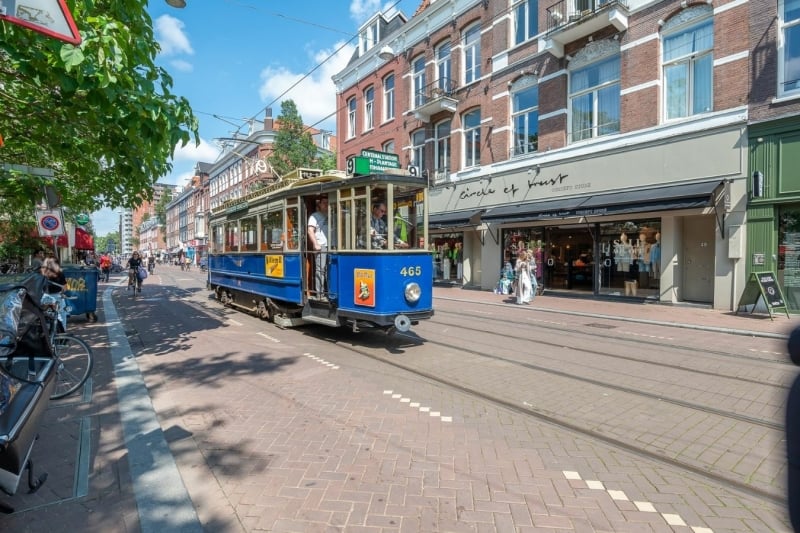 Old tram in de famous Ferdinand Bolstraat in Amsterdam, de Pijp