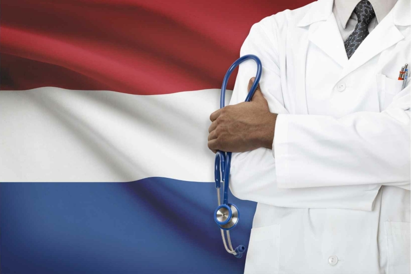 Dutch flag and a doctor illustrating healthcare in The Netherlands