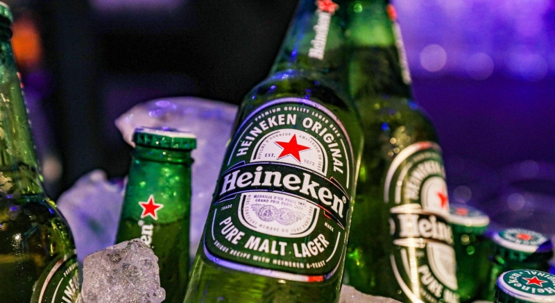 4 bottled Heineken beer in ice bucket